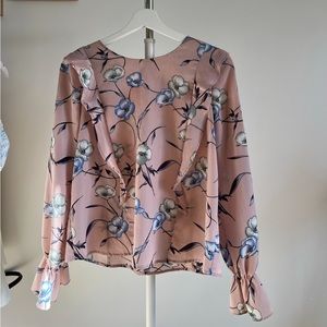 Pink blouse with blue flowers